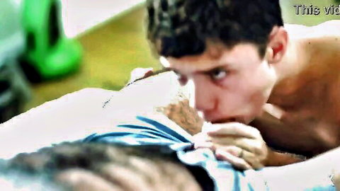 Skinny brunette twink deepthroating hairy DILF's thick cock in intense gay blowjob.