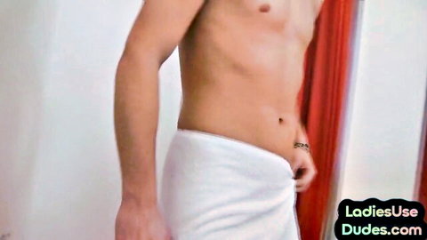 Muscular shirtless hunk teasing towel drop revealing abs and piercing