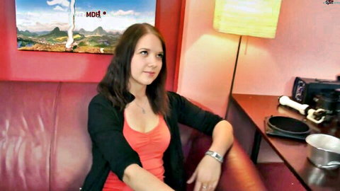 Cute brunette student in tank top and cardigan with Tom-Weide