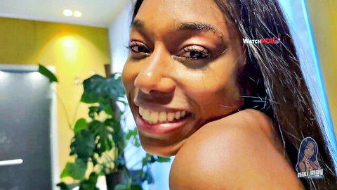 Smiling ebony beauty Mia Malaika teases with bare shoulders in seductive closeup