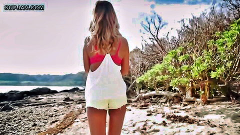 AIKA walks tease on beach in white tank top and short shorts