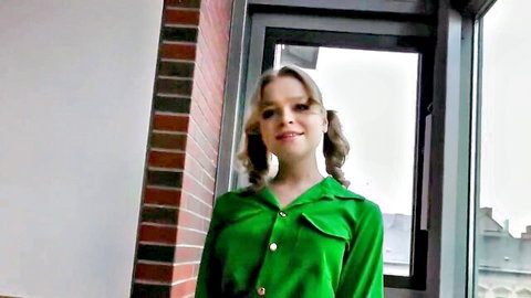 Alexa Flexy smiling in green dress with blonde pigtails