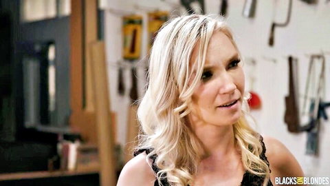 Blonde Claire Roos in lacy top teasing as sexy mechanic in shop