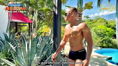 Salome Gil Colombian beauty poolside with muscular man in underwear