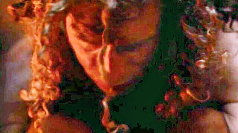 Angie Faith intense close-up with fiery red curls in Allegory Of The Cave porn scene