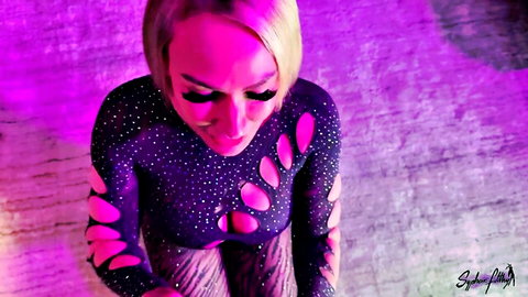 Curvy blonde bombshell in sparkly purple cutout bodysuit teasing huge tits cleavage