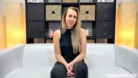 Blonde Czech Adela smiling in black top before oiling up