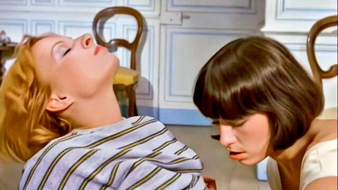 Vintage lesbian scene with redhead in ecstasy as brunette kisses her neck