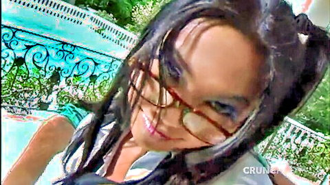 Smiling Asian woman in glasses and pigtails by pool, ebony raw fuck tease