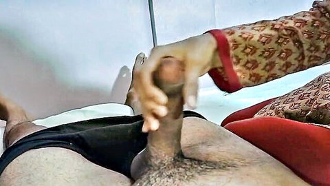 Punjabi Desi woman in traditional attire gripping erect penis handjob