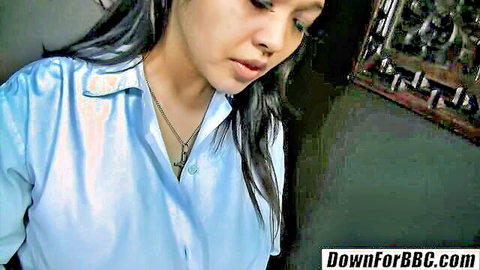 Sexy Asian brunette in shiny blue blouse teasing with parted lips for BBC