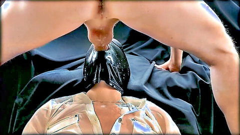 Dominant woman spreads wet pussy and asshole on hooded submissive man's face in intense BDSM facesitting