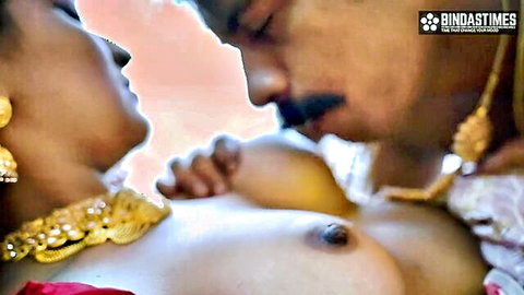 Desi Indian wife with exposed breasts in passionate kiss with husband