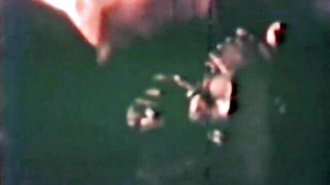 Vintage 1960s retro porn thumbnail of group scene in water with oral action