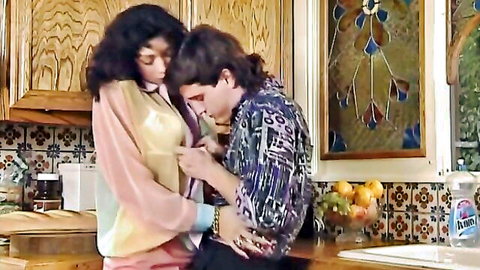 Sarah Louise Young and Tabatha Cash in passionate embrace, Goddess of Love scene