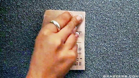 Woman's manicured hand scratching off pink erotic ticket reveal