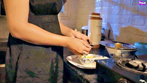 Raunchy Indian MILF sensually preparing food in kitchen