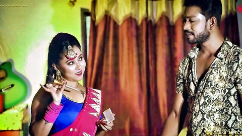 Desi girl in red sari seduces man with cigarette in hot Indian couple scene