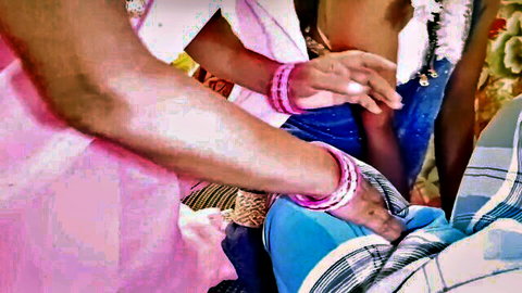 Indian women in sarees with pink bangles stroke a man's hard cock in amateur group handjob.