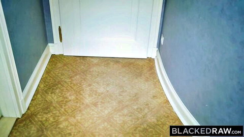 Empty hallway doorway with blue walls beige carpet and BlackedRaw watermark