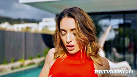 Sara Diamante in red top, seductive poolside pose, brunette beauty