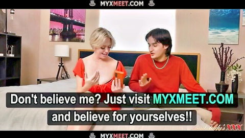 Dee Williams blonde MILF teasing with phone in red top, steamy couple scene