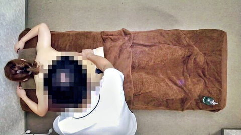 Topless Asian woman gets sensual back massage in erotic amateur video
