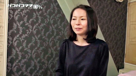 Mature Japanese housewife Keiko smiling in black blouse interview
