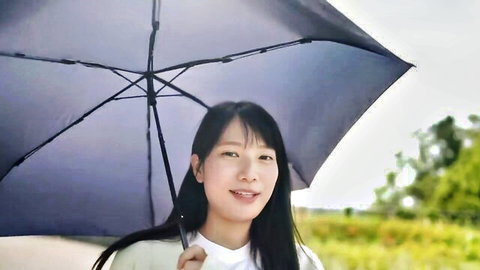 Sakakihara smiling outdoors with umbrella, uncensored first time JAV