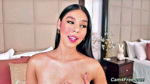 Sexy Asian babe topless, teasing with hand on breast in solo play