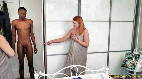 Redhead and brunette in towels tease nude black man in CFNM handjob scene
