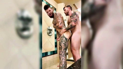 Steve Ricks romps muscular tattooed guy in public showers