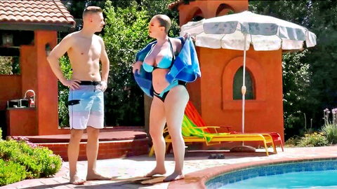 Dee Williams in blue bikini by pool with shirtless stud