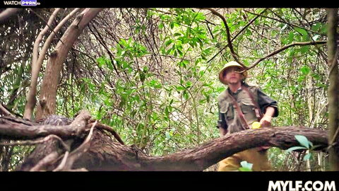 Miss Raquel as busty jungle explorer in khaki outfit