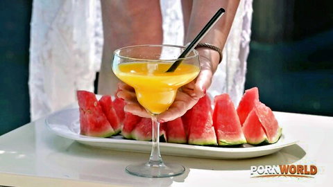 Olivia Del Rio holds a tropical orange cocktail with watermelons, busty Brazilian MILF tease