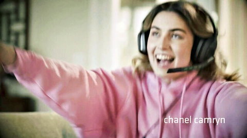 Chanel Camryn in pink hoodie, smiling with headphones, Game Mode adult scene