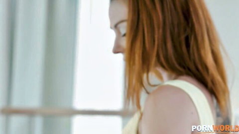 Fit redhead Leyla in white tank top, yoga tease profile view