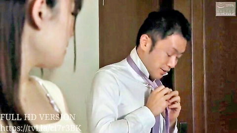 Scarlet Love as young wife in close moment with older man tying tie, JAV style
