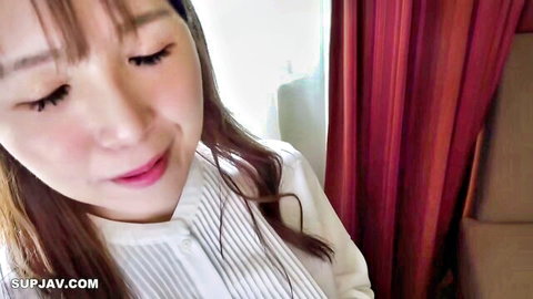 Seductive Asian woman in white collared shirt, close-up gaze