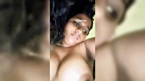 Malayali wife with big round boobs exposed, curly hair, intimate pose