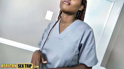 Sexy ebony nurse in gray scrubs looks up with open mouth teasing for cock