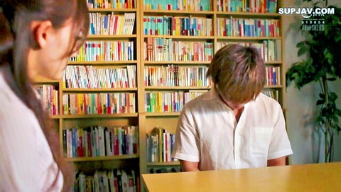 Japanese teacher with glasses smiles at student in JAV scene