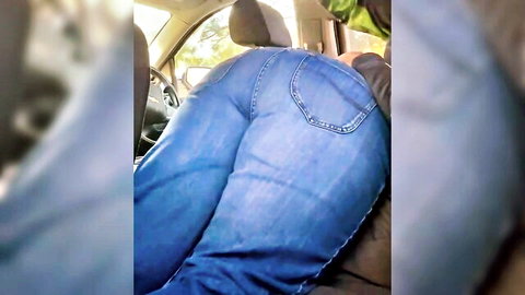 Thick curvy woman in tight blue jeans showing off round ass in car seat