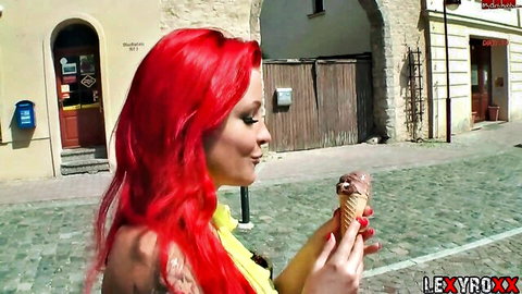 LexyRoxx redhead in yellow top holds ice cream cone on street