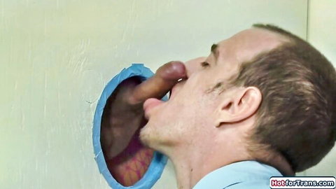 White guy deepthroats massive black cock through gloryhole in wall