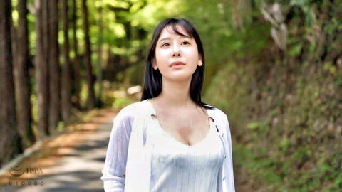 Japanese beauty with big tits showing deep cleavage in sheer white top on forest path