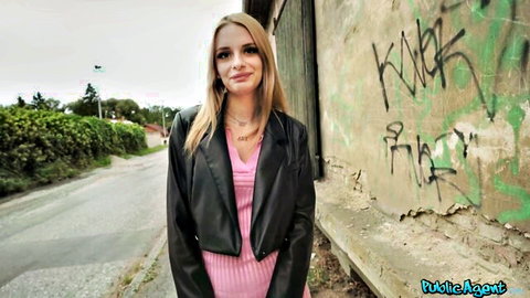 Naomi Love in black leather jacket and pink top, Public Agent outdoor graffiti scene