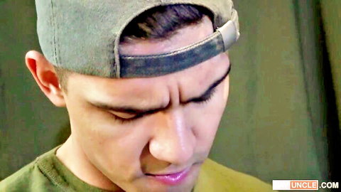 Intense Asian guy in military cap and green shirt, seductive gaze for Kinky Smugglers