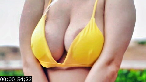 Marica Chanelle in yellow bikini showcasing massive cleavage