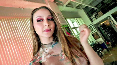 Skinny young brunette with small tits in sheer floral top teasing with kissy face POV